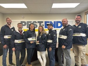 Pest-End leadership team poses with Pinnacle Performance Award