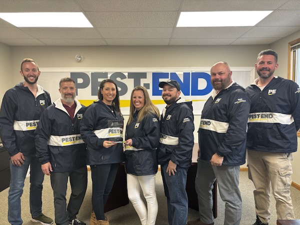 Pest-End leadership team poses with Pinnacle Performance Award