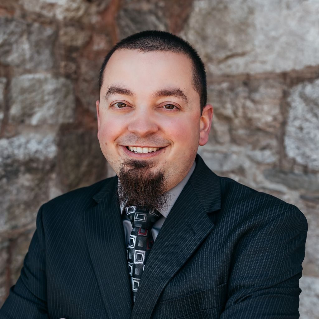 headshot of Adam Carace